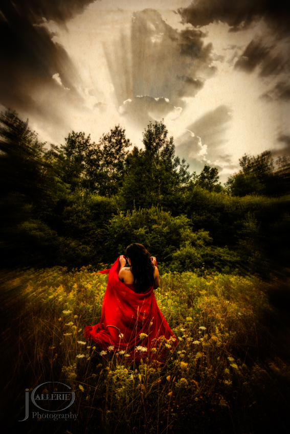 Fine Art Photograph of a woman in red with a dramatic sky.